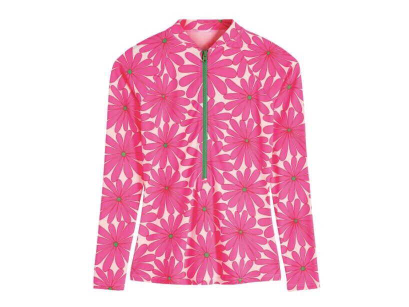Pink long-sleeve blouse with an all-over large flower print and a green front zipper at the center.