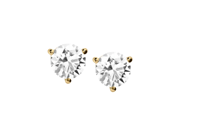 Pair of diamond stud earrings with gold settings on a white background