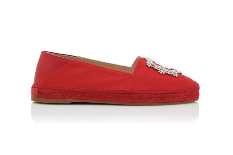 Red espadrille flat with crystal embellishment on the toe, side view modelled on a white background, low-cut silhouette.